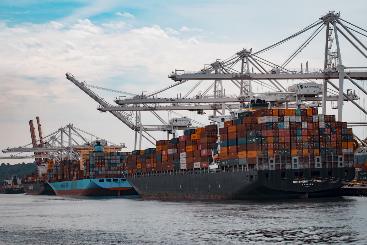 Container vessels being loaded at a port terminal