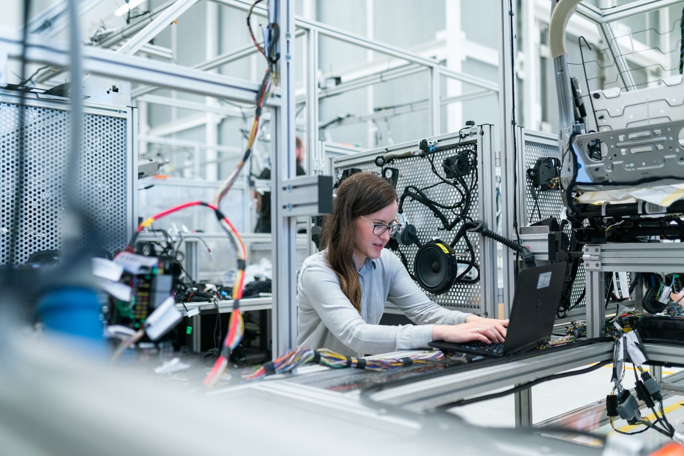 Engineer reviewing production data at a manufacturing workstation