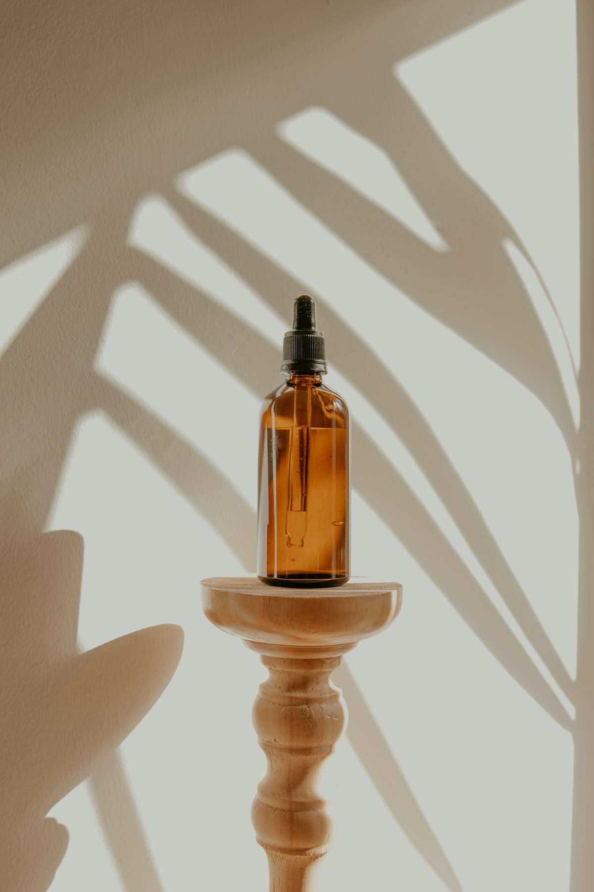 Amber glass cosmetic bottle in natural light